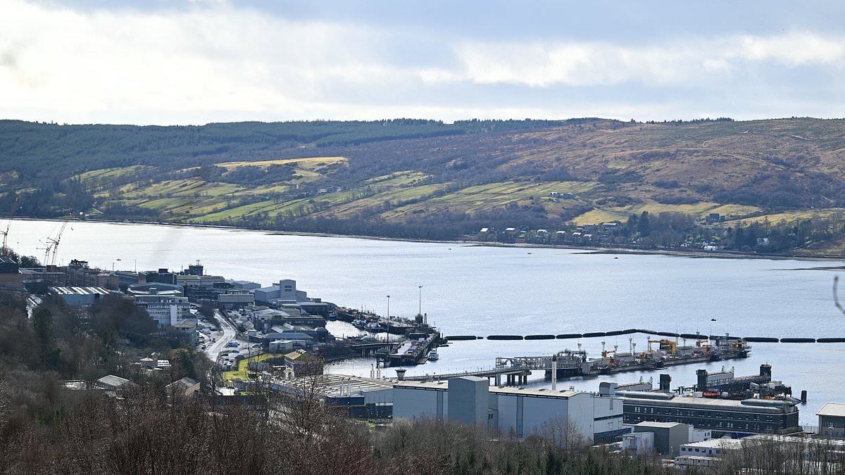 Iranian man and Romanian woman are charged after 'trying to enter naval base that is home to Britain's nuclear submarines'