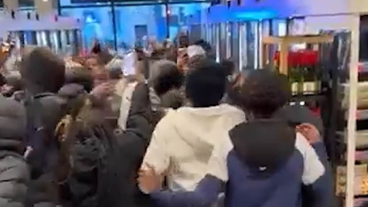 Moment mob of youths run riot in M&S store as police watch on powerless yet again in lawless London