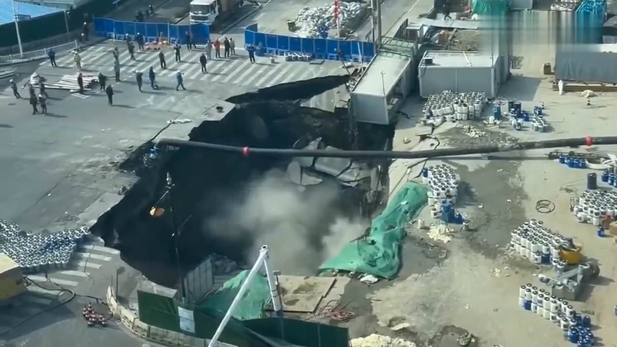 Incredible moment street is swallowed up by gigantic sinkhole in China