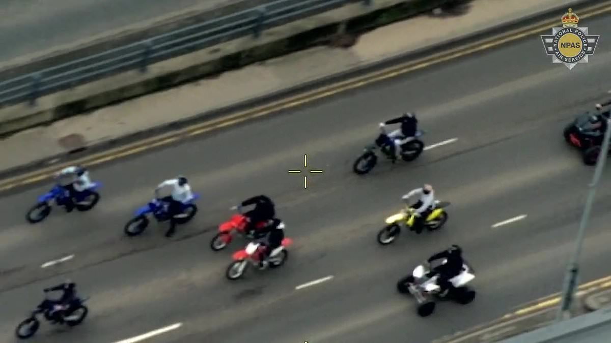 Moment police rider knocks suspect off his motorbike after 'gang's dangerous ride-out' through city centre