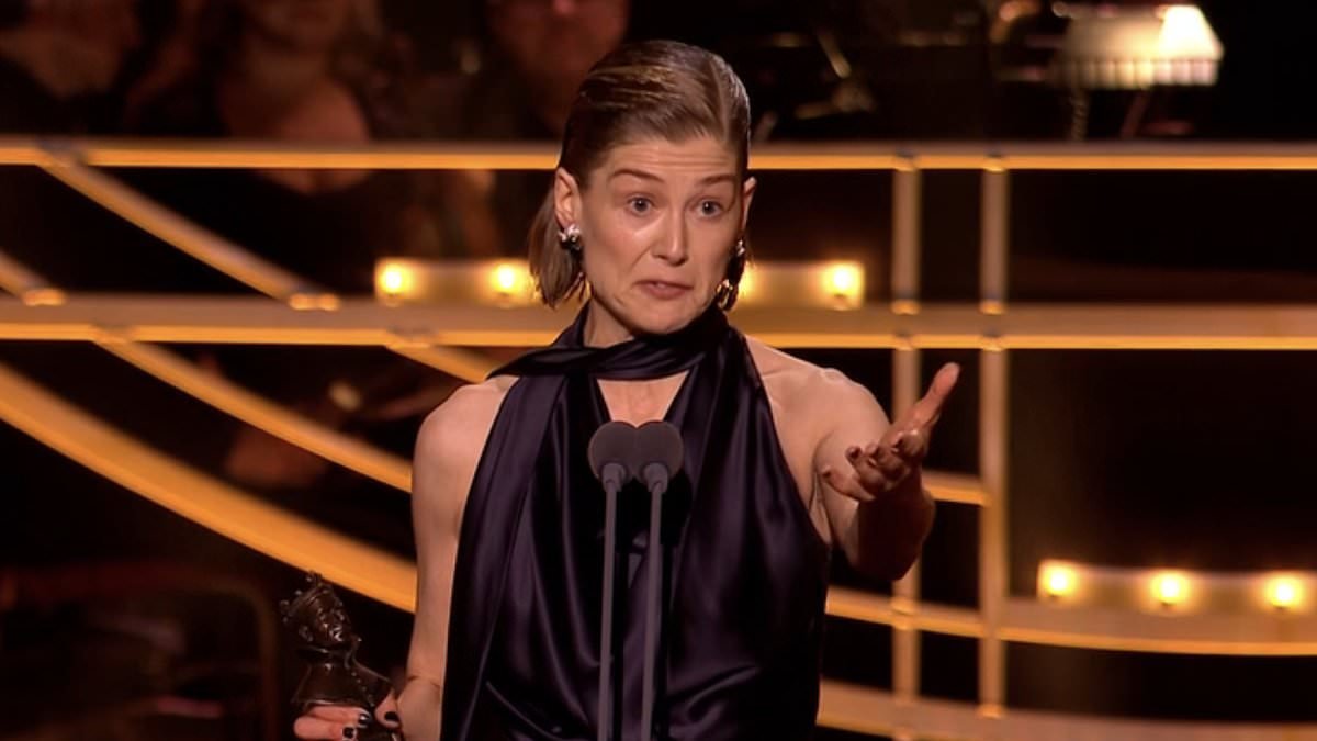 Rosamund Pike breaks down in tears as she pays tribute to her rarely-seen partner for 'staying home and taking care of her sons' after winning Best Actress at Olivier Awards