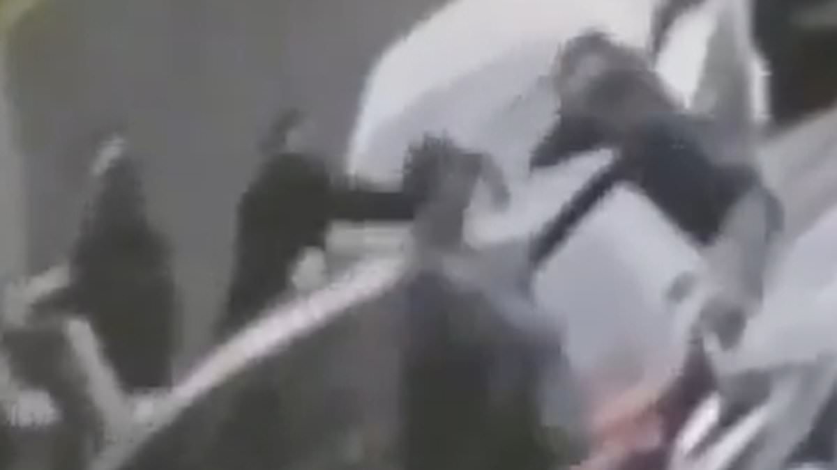 Moment armed police swoop on 'escaped prisoner' outside gym as officers surround his car and block him in when he tries to make getaway