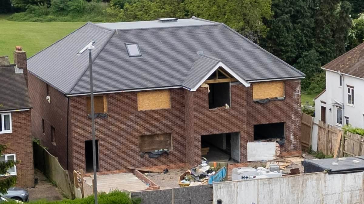 Neighbours' fury as 'unneighbourly and overbearing' newbuild six-bed mansion still has not been demolished despite homeowner being ordered to get rid of it TWICE