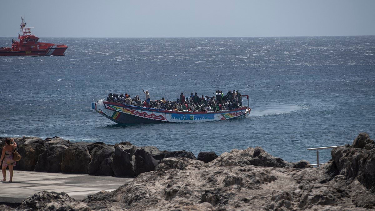 Spain gives 500,000 undocumented migrants legal status as left-wing government is accused of 'hating' Spaniards and 'accelerating an invasion'