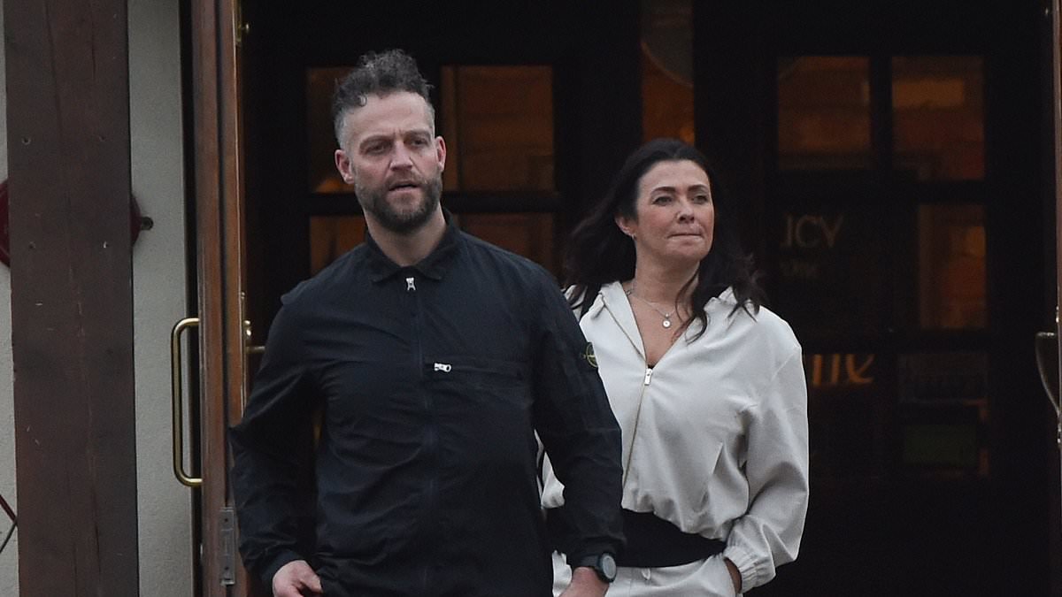 Newly engaged Kym Marsh shows off her ring as she and fiancé Tom Dickinson step out in Manchester