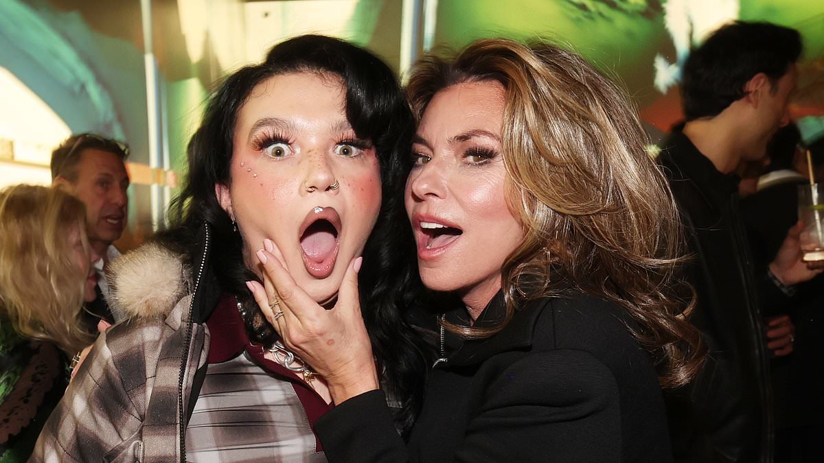 Lola Young toasts her first-ever Grammy win with an energy drink as she parties with Shania Twain at star-studded Universal bash