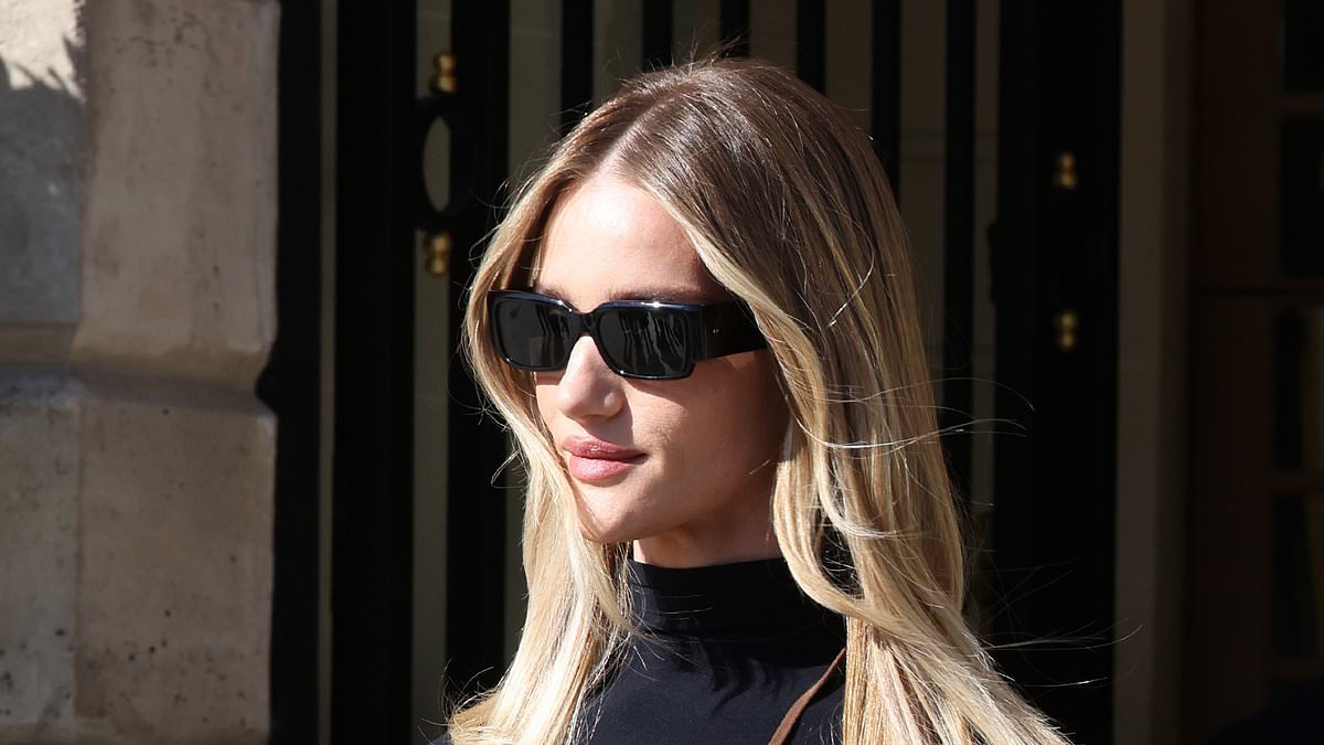 Braless Rosie Huntington-Whiteley looks chic in a skintight top and suede pencil skirt as she leads the style pack during another day at Paris Fashion Week