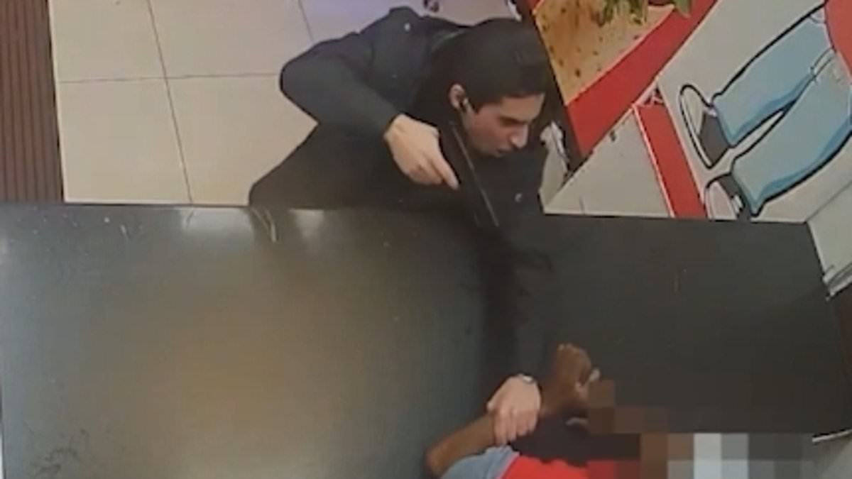 Moment thug threatens to kill chicken shop worker with a fake gun after row broke out over garlic sauce