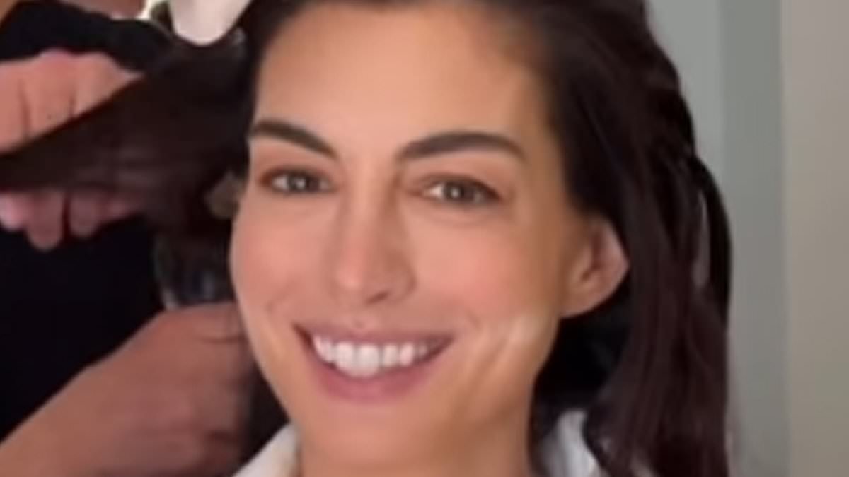 Anne Hathaway, 43, jokes she's transforming into 'Grand High Witch' and pokes fun at viral comments about her taut face in Oscars BTS video