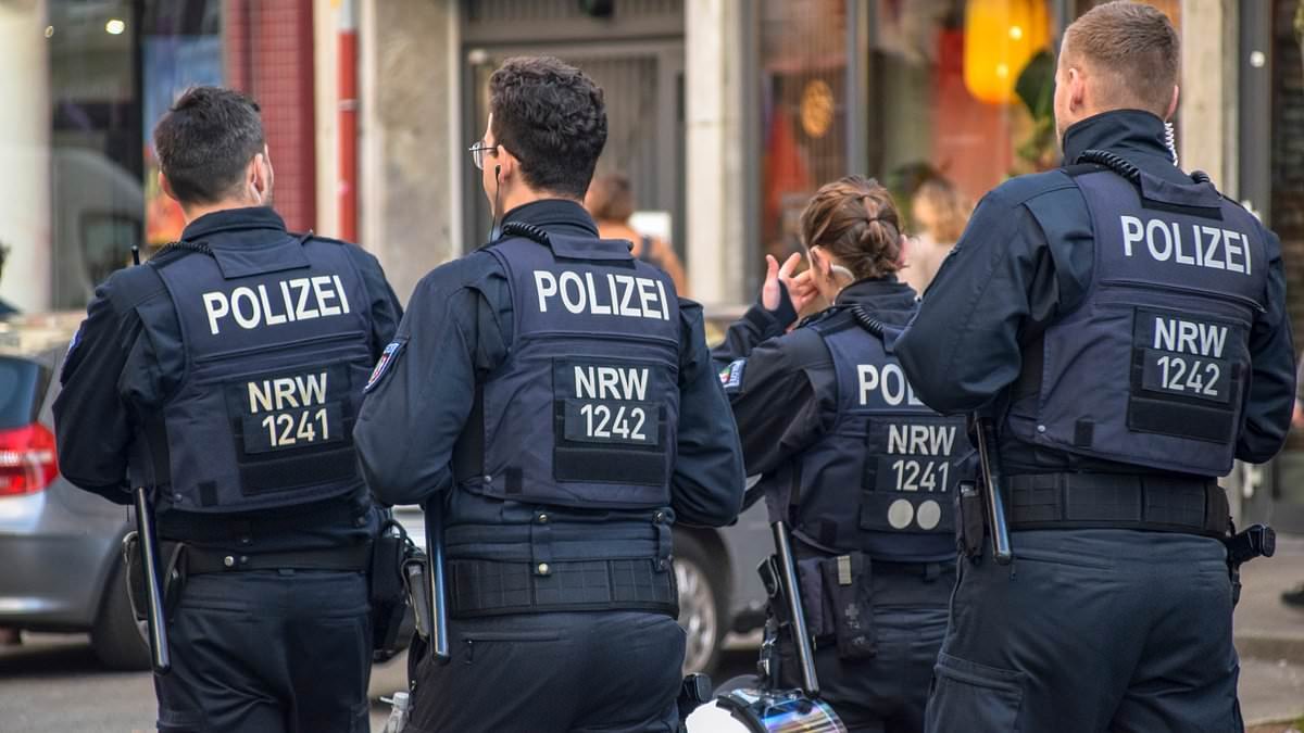 Afghan knifeman attacks multiple people at Jehovah's Witness stand in German train station before being overpowered by hero civilians